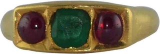 Gold Ring Studded with Red Burmese Rubies and Blue Emerald.