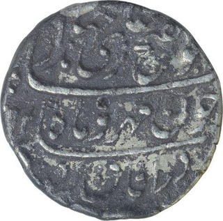 Silver One Rupee Coin of Jahandar Shah of Surat Mint.