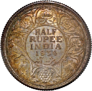 Uncirculated Silver Half Rupee Coin of King George V of Calcutta Mint of 1934 with Toning.