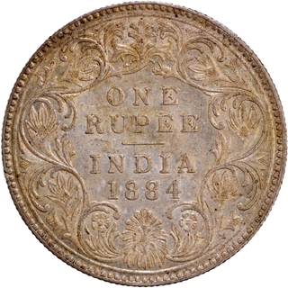 B Raised Silver One Rupee Coin of Victoria Empress of Bombay Mint of 1884.