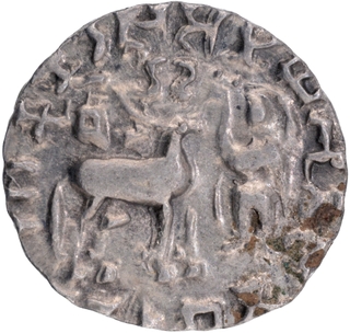 Silver Drachma Coin of Amoghbuti of Kunindas with split arm Indradhvaja on the reverse.