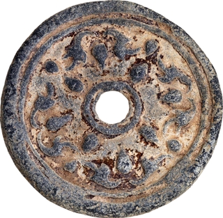 Lead Tin Coin of Khmer Dynasty with floral design.