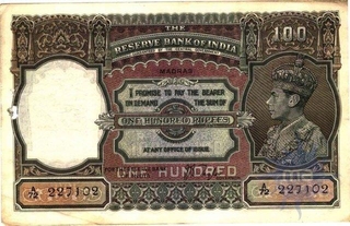 Hundred Rupees Bank Note of  King George VI of Signed by   C D  Deshmukh of  Calcutta Circle.