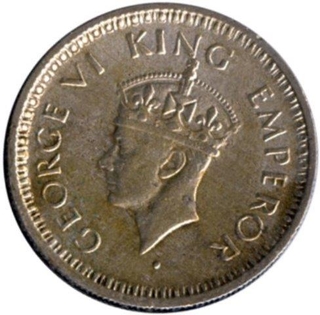 Silver Quarter Rupee of King George VI of Lahore Mint of 1945.