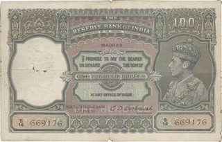 1938 British India One Hundred Rupees Note of King George VI Signed by C D Deshmukh of Madras Circle.