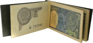 One Rupee Booklet of King George V with 15 Bank Notes Signed by J.W. Kelly of 1935.