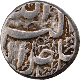 	A Rare Bird Type Silver Rupee Coin of Akbar of Berar Mint, floral decorated background.	