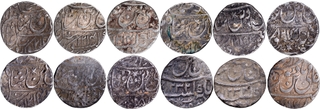 Lot of Twelve Silver Rupee Coins of Muhammadabad Banaras Mint of Awadh State in Very fine to Extremely Fine Condition.