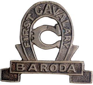 	First Cavalry Cap Badge of Baroda in white metal in In Extremely fine Condition.	