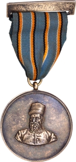 Silver Medal of 35 Years Service of Tata Textiles of 1974.