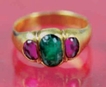Gold Ring Studded with Red Burmese Rubies and Blue Emerald.